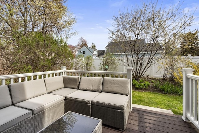 deck featuring outdoor lounge area and a fenced backyard