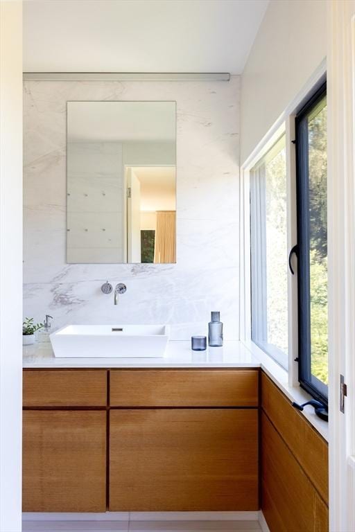 bathroom with vanity and a healthy amount of sunlight