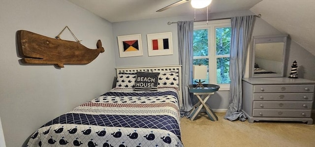 bedroom featuring lofted ceiling, ceiling fan, and carpet flooring