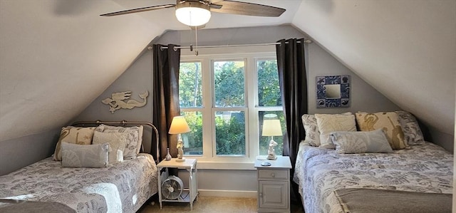 carpeted bedroom with multiple windows, vaulted ceiling, and ceiling fan