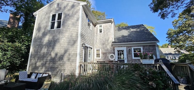 back of property featuring an outdoor hangout area