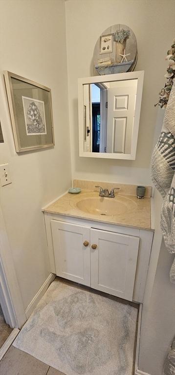 bathroom featuring tile patterned flooring and vanity