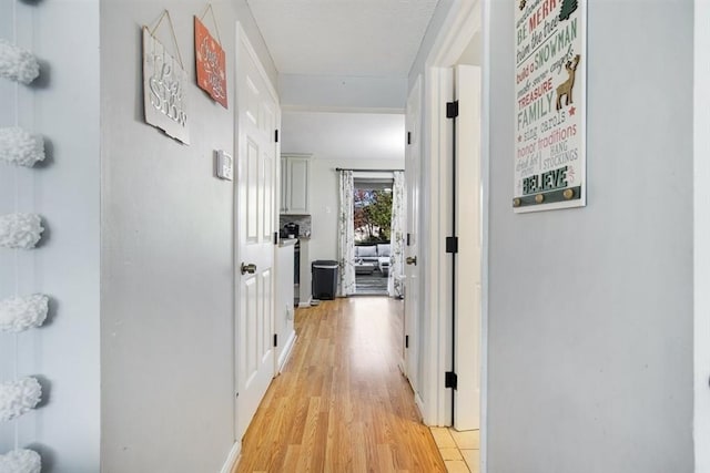 hallway featuring light wood-type flooring