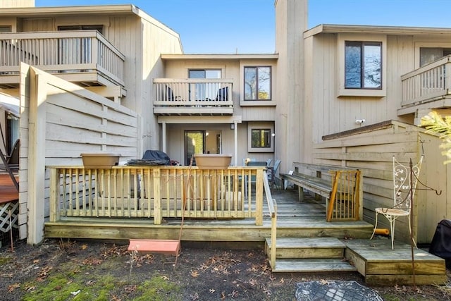 back of house featuring a deck