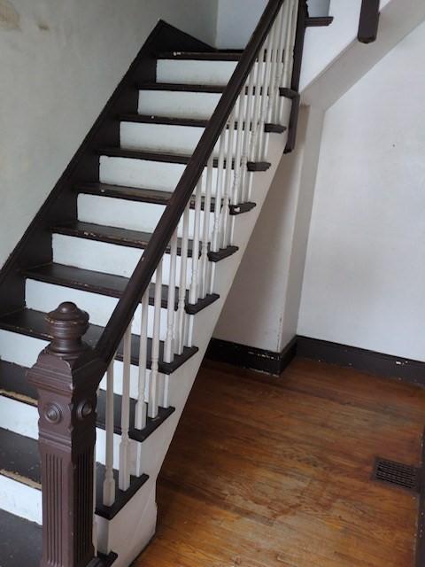 staircase featuring hardwood / wood-style floors