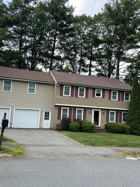 11 Solitaire Dr, Haverhill, MA 01830 - colonial inspired home with a garage, asphalt driveway, and a front yard