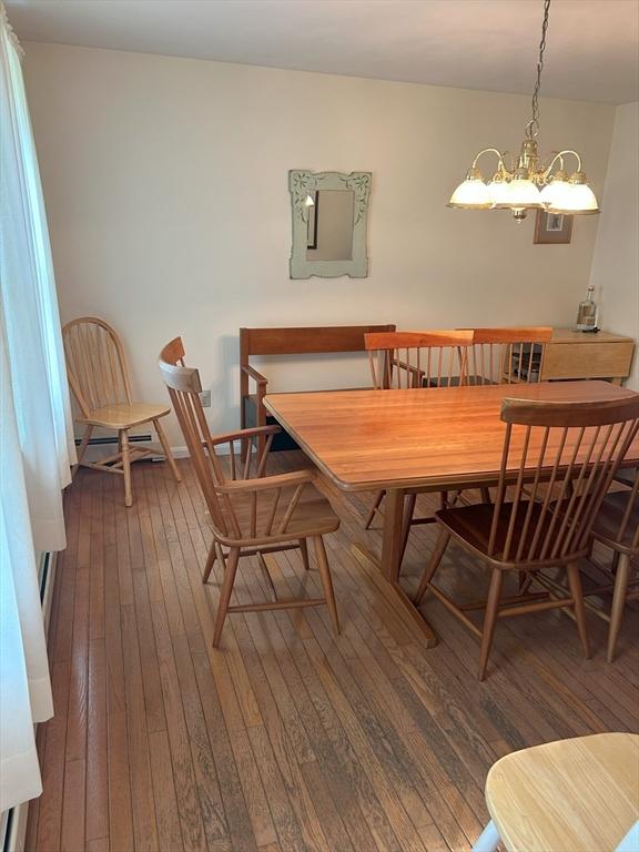 11 Solitaire Dr, Haverhill, MA 01830 - dining area with hardwood / wood-style flooring and a chandelier