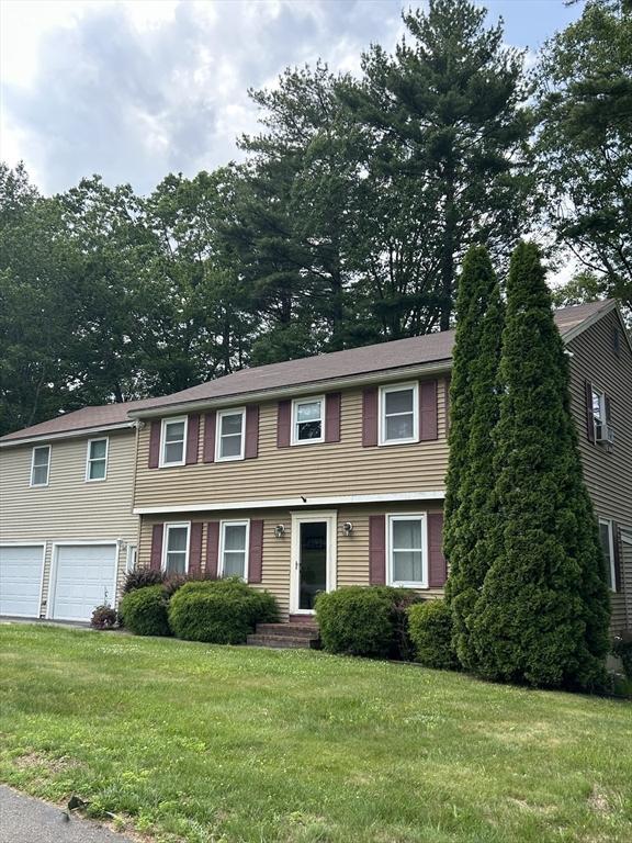 11 Solitaire Dr, Haverhill, MA 01830 - colonial home featuring a garage and a front lawn