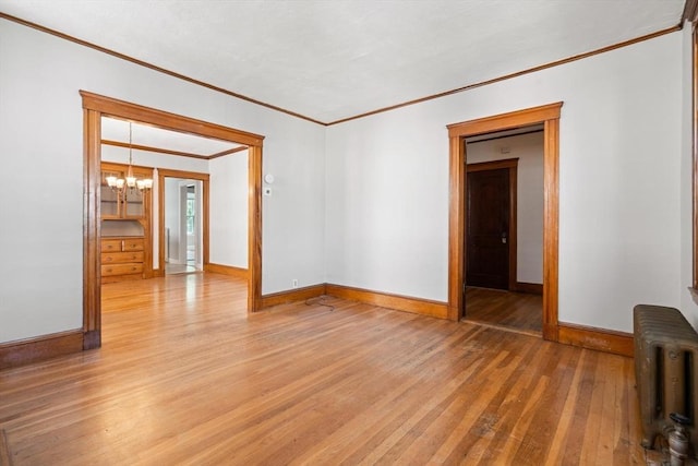 25-27 Morrow Rd, Boston, MA 02135 - unfurnished room featuring crown molding, radiator, light wood-style flooring, and a chandelier