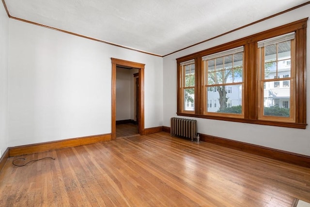 25-27 Morrow Rd, Boston, MA 02135 - unfurnished room featuring radiator, ornamental molding, and light wood-style floors