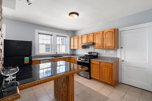 25-27 Morrow Rd, Boston, MA 02135 - kitchen featuring stainless steel appliances, under cabinet range hood, a kitchen breakfast bar, light tile patterned floors, and a peninsula