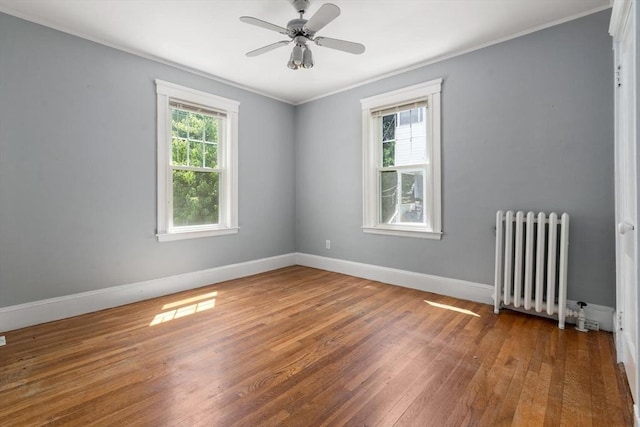 25-27 Morrow Rd, Boston, MA 02135 - unfurnished room featuring radiator heating unit, hardwood / wood-style floors, ornamental molding, and ceiling fan