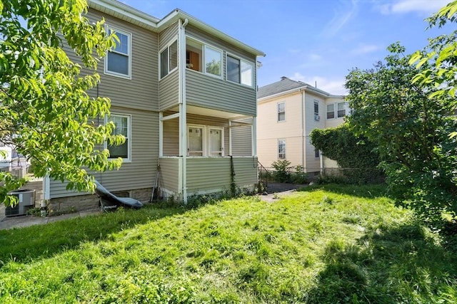 25-27 Morrow Rd, Boston, MA 02135 - back of property featuring a yard