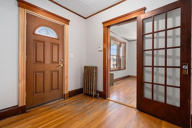 25-27 Morrow Rd, Boston, MA 02135 - entryway featuring radiator, ornamental molding, and hardwood / wood-style floors