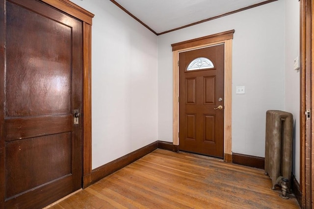25-27 Morrow Rd, Boston, MA 02135 - foyer with radiator heating unit, crown molding, and wood finished floors