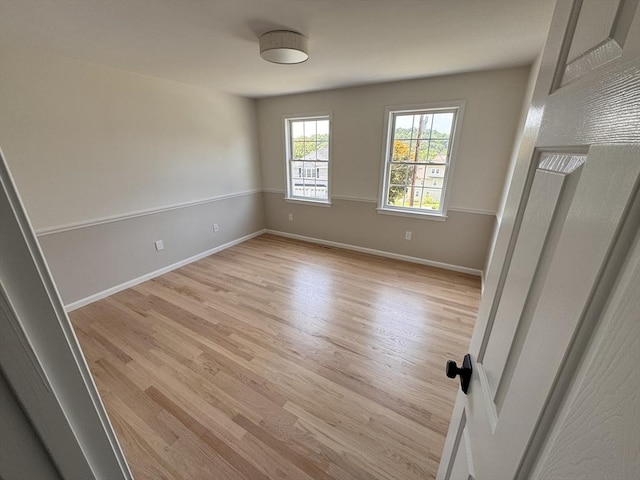 54 Vose St, Framingham, MA 01702 - spare room with light wood-style floors and baseboards