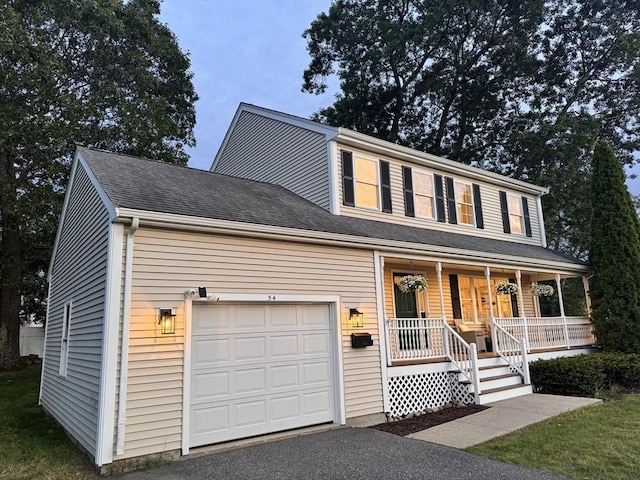 54 Vose St, Framingham, MA 01702 - view of front facade featuring covered porch and driveway