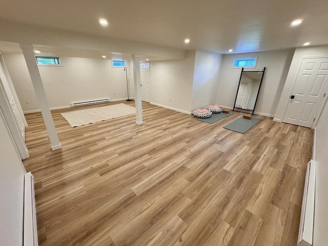 54 Vose St, Framingham, MA 01702 - basement with a baseboard radiator, recessed lighting, and light wood finished floors