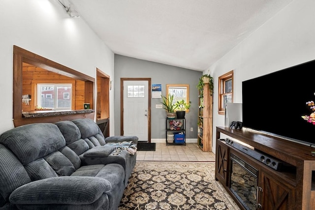 tiled living room with vaulted ceiling