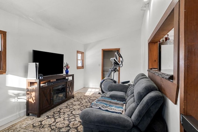 living room featuring vaulted ceiling