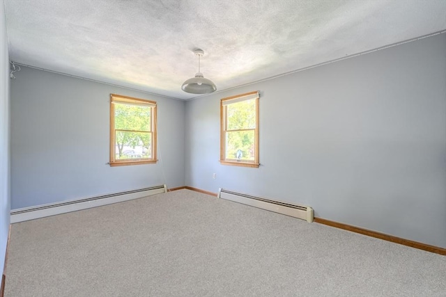 12 Jensen Ave, Chelmsford, MA 01824 - carpeted spare room with a baseboard radiator and baseboards