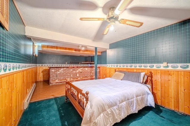 12 Jensen Ave, Chelmsford, MA 01824 - carpeted bedroom with baseboard heating, wooden walls, and wainscoting