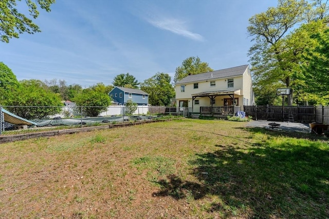 12 Jensen Ave, Chelmsford, MA 01824 - view of yard with an outdoor fire pit and a deck