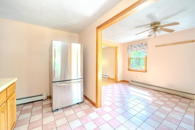 12 Jensen Ave, Chelmsford, MA 01824 - kitchen with freestanding refrigerator, a baseboard heating unit, ceiling fan, and light countertops
