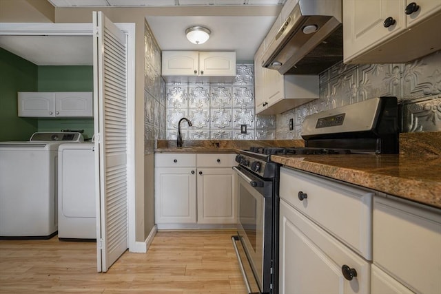 998 Wood, Swansea, MA 02777 - kitchen featuring washing machine and clothes dryer, stainless steel gas range oven, extractor fan, light wood finished floors, and decorative backsplash