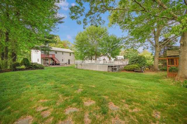 998 Wood, Swansea, MA 02777 - view of green lawn with stairway, a deck, and a swimming pool
