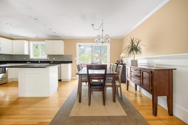 998 Wood, Swansea, MA 02777 - dining space with a chandelier, light wood finished floors, and ornamental molding