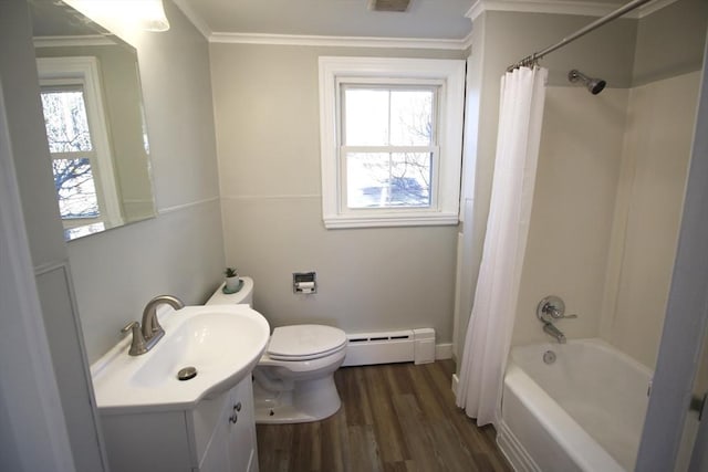 bathroom featuring toilet, ornamental molding, wood finished floors, vanity, and a baseboard radiator