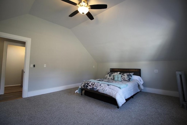 carpeted bedroom featuring vaulted ceiling, a ceiling fan, and baseboards