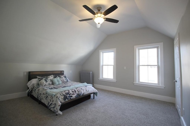 carpeted bedroom featuring baseboards, lofted ceiling, radiator, and a ceiling fan