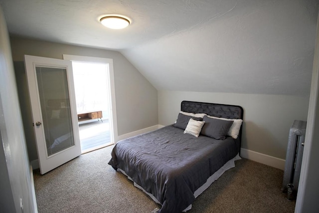 carpeted bedroom with lofted ceiling, radiator heating unit, and baseboards