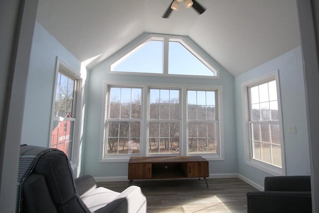 sunroom / solarium featuring ceiling fan and lofted ceiling