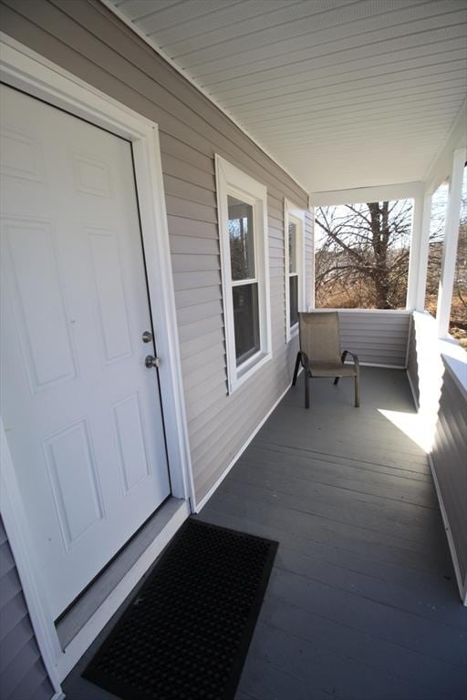 wooden terrace featuring a porch