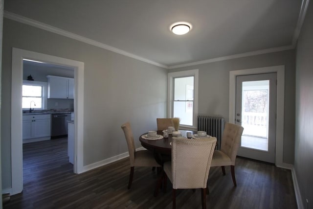 dining area featuring a healthy amount of sunlight, baseboards, and ornamental molding