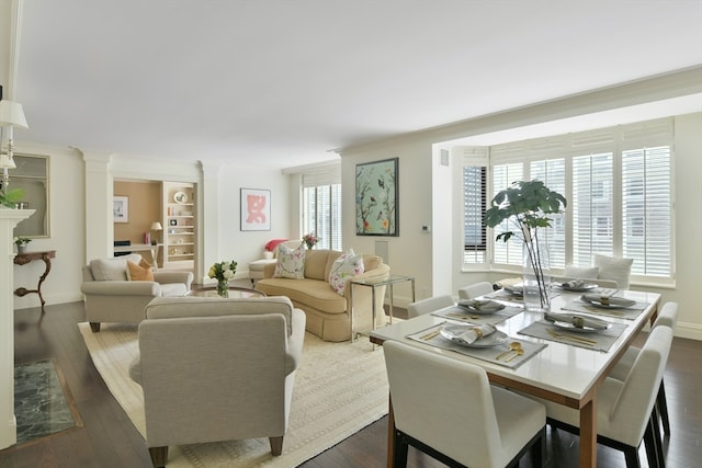 living room featuring crown molding and dark hardwood / wood-style floors