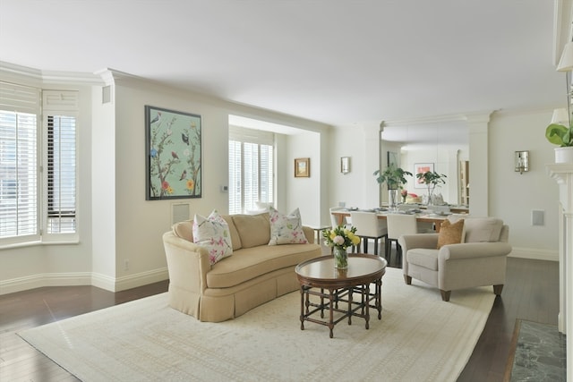 living room featuring ornamental molding and dark hardwood / wood-style floors