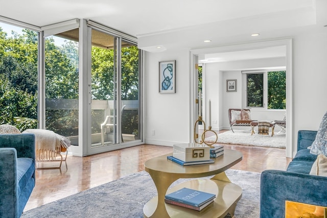 living room featuring expansive windows and parquet flooring