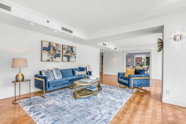 living room featuring light parquet flooring and crown molding