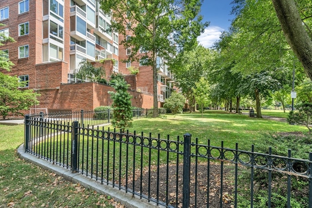 view of property's community with a lawn