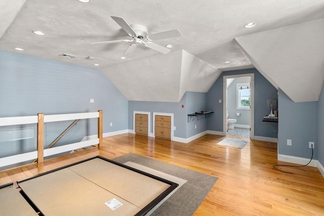 379 Hunnewell St, Needham, MA 02494 - unfurnished bedroom with baseboards, vaulted ceiling, wood finished floors, recessed lighting, and a ceiling fan