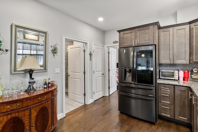 379 Hunnewell St, Needham, MA 02494 - kitchen with refrigerator with ice dispenser, dark wood-style floors, dark brown cabinetry, and recessed lighting