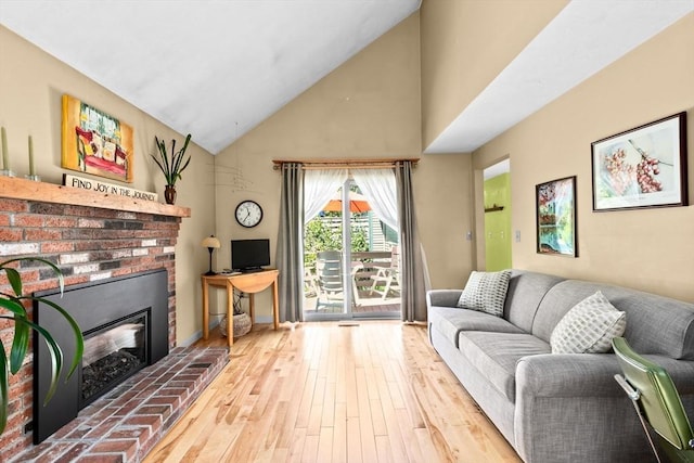 46 Michael Rd Unit 46, Bridgewater, MA 02324 - living room featuring high vaulted ceiling, wood finished floors, and a fireplace