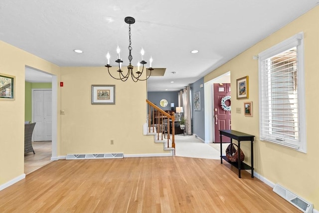 46 Michael Rd Unit 46, Bridgewater, MA 02324 - dining space with light wood-style flooring, a chandelier, stairs, and recessed lighting