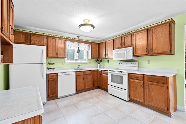 46 Michael Rd Unit 46, Bridgewater, MA 02324 - kitchen with white appliances, brown cabinetry, and light countertops