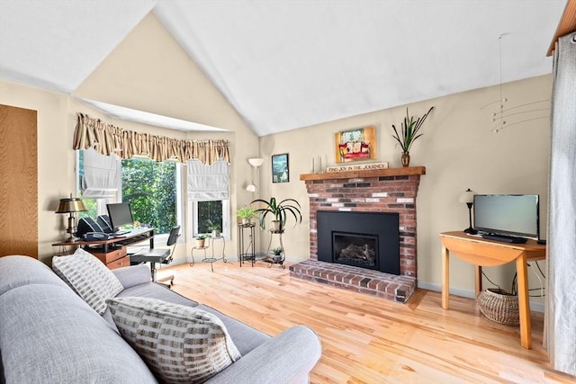 46 Michael Rd Unit 46, Bridgewater, MA 02324 - living area featuring wood finished floors, a fireplace, and high vaulted ceiling