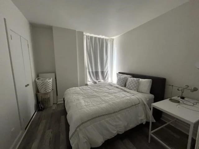 bedroom featuring dark hardwood / wood-style floors